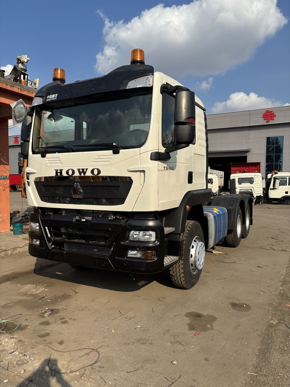 HOWO 6x4 tractor head, front view, in our Jining yard